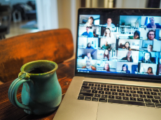 A mug and a laptop on a table
